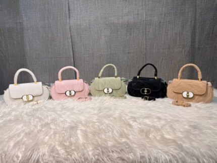Elegant mini top handle handbag for women with gold lock closure and structured design