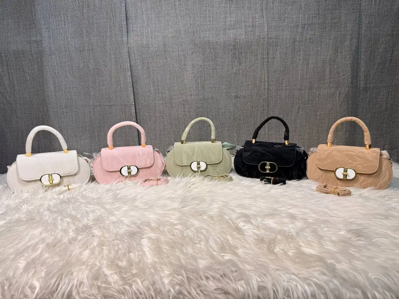 Elegant mini top handle handbag for women with gold lock closure and structured design Elegant mini top handle handbag for women with gold lock closure and structured design